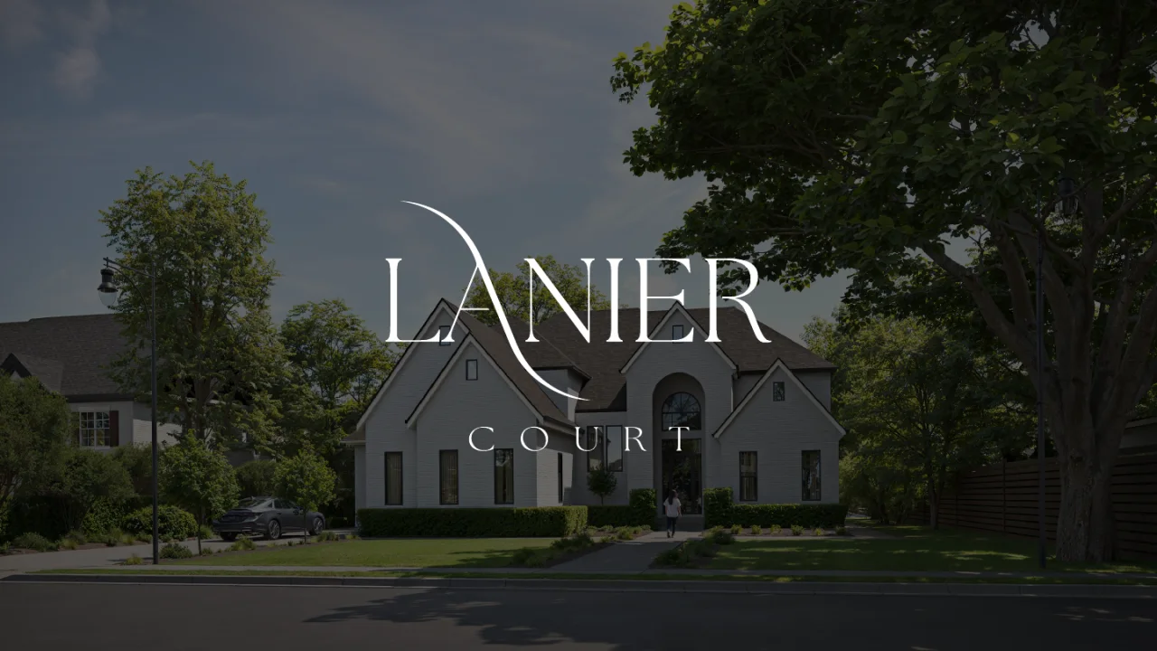 Lanier Court logo in white over a photograph of a house at dusk
